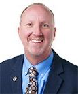 Headshot - Gentleman in Dark suit with Blue shirt and tie